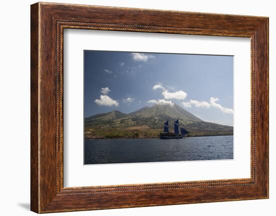 An Indonesian Pinisi Schooner Sails Near a Remote Volcanic Island-Stocktrek Images-Framed Photographic Print