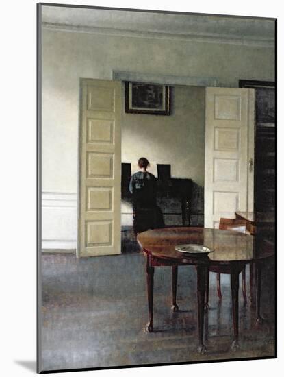 An Interior with a Woman Playing Piano, 1910-Vilhelm Hammershoi-Mounted Giclee Print