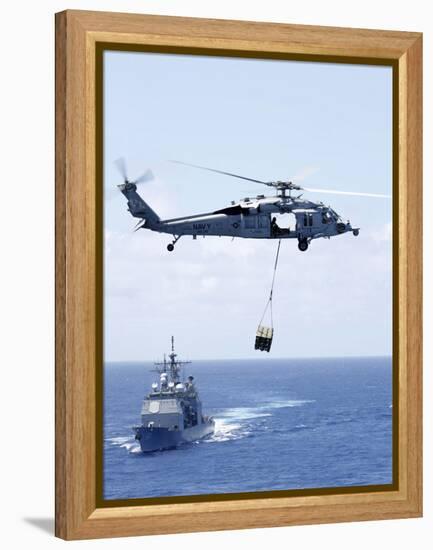 An Mh-60S Sea Hawk Helicopter Flying in Front of USS Gettysburg-null-Framed Premier Image Canvas