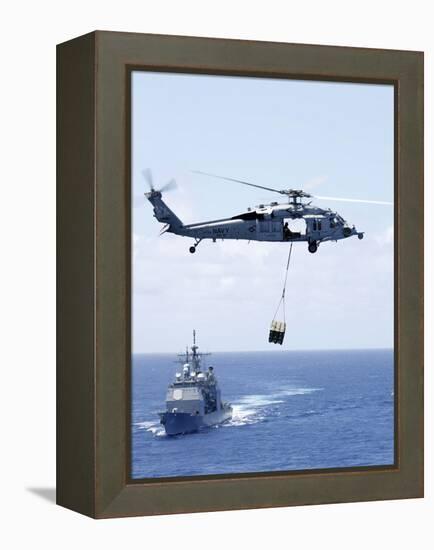 An Mh-60S Sea Hawk Helicopter Flying in Front of USS Gettysburg-null-Framed Premier Image Canvas