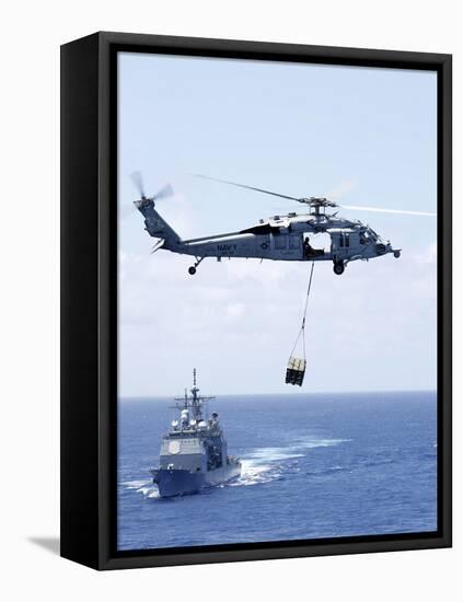 An Mh-60S Sea Hawk Helicopter Flying in Front of USS Gettysburg-null-Framed Premier Image Canvas