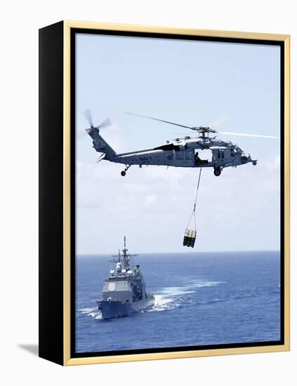 An Mh-60S Sea Hawk Helicopter Flying in Front of USS Gettysburg-null-Framed Premier Image Canvas