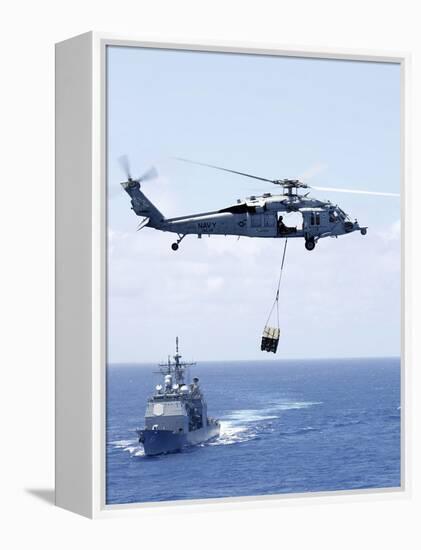 An Mh-60S Sea Hawk Helicopter Flying in Front of USS Gettysburg-null-Framed Premier Image Canvas