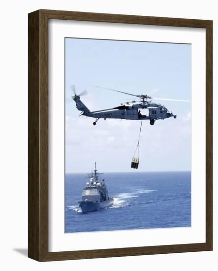 An Mh-60S Sea Hawk Helicopter Flying in Front of USS Gettysburg-null-Framed Photographic Print