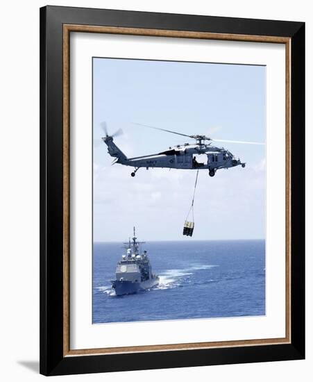 An Mh-60S Sea Hawk Helicopter Flying in Front of USS Gettysburg-null-Framed Photographic Print