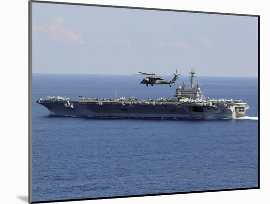 An MH-60S Seahawk Helicopter Flies over USS George H.W. Bush-Stocktrek Images-Mounted Photographic Print