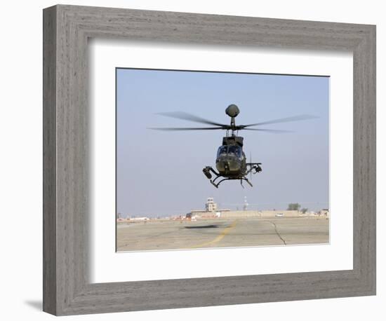 An Oh-58D Kiowa Warrior Hovers over the Flight Line at Camp Speicher, Iraq-null-Framed Photographic Print