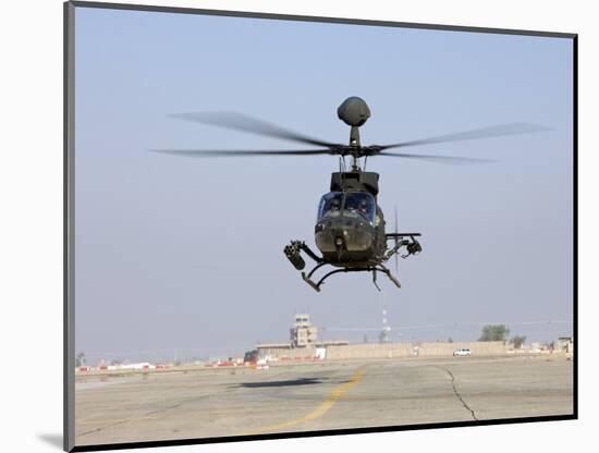 An Oh-58D Kiowa Warrior Hovers over the Flight Line at Camp Speicher, Iraq-null-Mounted Photographic Print