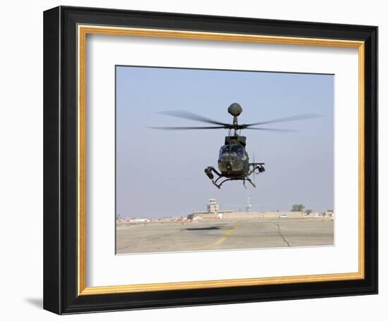 An Oh-58D Kiowa Warrior Hovers over the Flight Line at Camp Speicher, Iraq-null-Framed Photographic Print