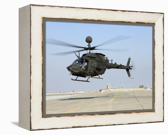 An Oh-58D Kiowa Warrior Hovers over the Flight Line at Camp Speicher, Iraq-null-Framed Premier Image Canvas