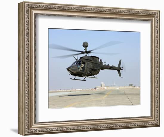 An Oh-58D Kiowa Warrior Hovers over the Flight Line at Camp Speicher, Iraq-null-Framed Photographic Print