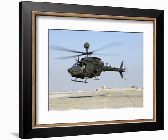 An Oh-58D Kiowa Warrior Hovers over the Flight Line at Camp Speicher, Iraq-null-Framed Photographic Print