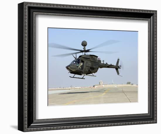 An Oh-58D Kiowa Warrior Hovers over the Flight Line at Camp Speicher, Iraq-null-Framed Photographic Print