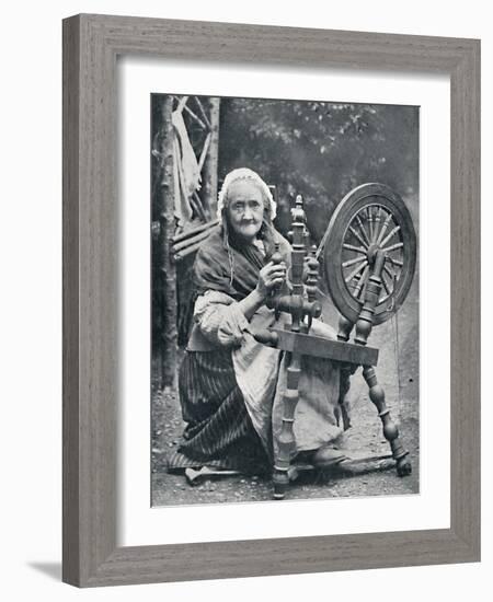 An old Irish woman at her spinning-wheel, 1912-W Lawrence-Framed Photographic Print