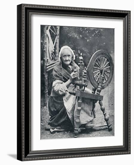 An old Irish woman at her spinning-wheel, 1912-W Lawrence-Framed Photographic Print