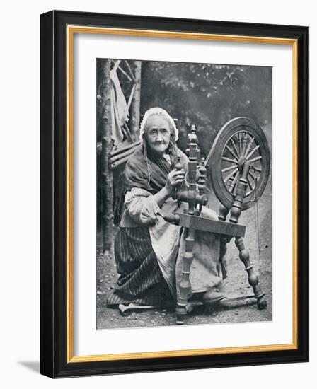 An old Irish woman at her spinning-wheel, 1912-W Lawrence-Framed Photographic Print