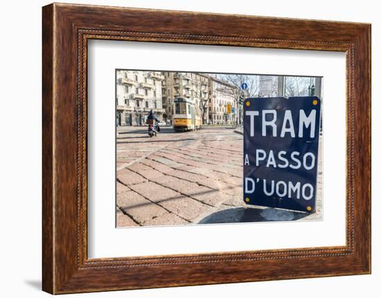 An old sign in Italian that says Trams go to Duomo, with a traditional Milanese tram in the backgro-Alexandre Rotenberg-Framed Photographic Print