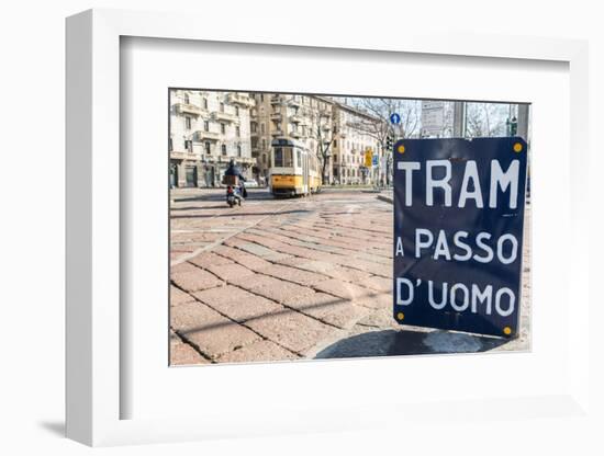 An old sign in Italian that says Trams go to Duomo, with a traditional Milanese tram in the backgro-Alexandre Rotenberg-Framed Photographic Print