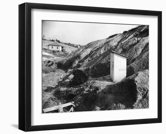 An Outhouse in an Area That Is Plagued with Soil Erosion-Alfred Eisenstaedt-Framed Photographic Print