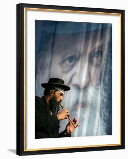 An Ultra-Orthodox Jewish Man Plays a Flute-null-Framed Photographic Print