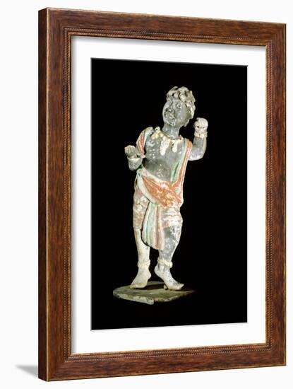 An unglazed and painted pottery model of a curly-headed and bejewelled youth-Werner Forman-Framed Giclee Print