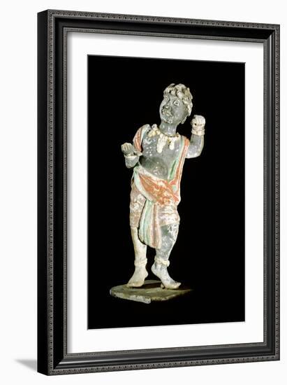 An unglazed and painted pottery model of a curly-headed and bejewelled youth-Werner Forman-Framed Giclee Print