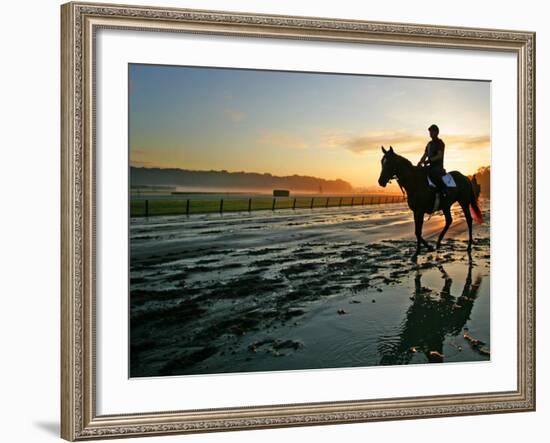 An Unidentified Horse and Rider on the Track at Sunrise at Belmont Park-null-Framed Photographic Print