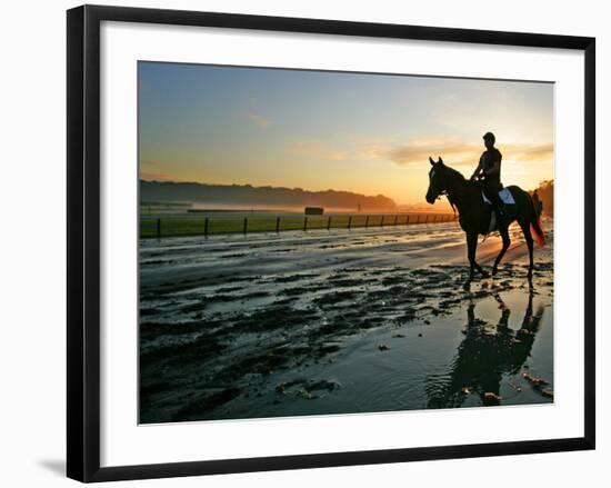 An Unidentified Horse and Rider on the Track at Sunrise at Belmont Park-null-Framed Photographic Print