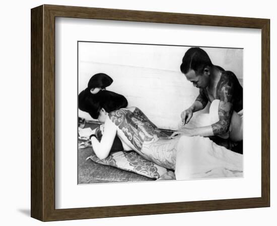 An Unidentified Japanese Tattoo Artist Works on a Woman's Backside--Framed Photographic Print