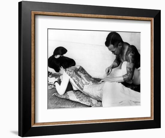 An Unidentified Japanese Tattoo Artist Works on a Woman's Backside--Framed Photographic Print