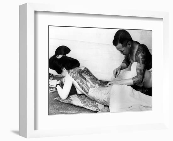 An Unidentified Japanese Tattoo Artist Works on a Woman's Backside--Framed Photographic Print