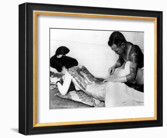 An Unidentified Japanese Tattoo Artist Works on a Woman's Backside--Framed Photographic Print