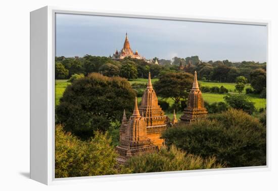 Ancient temple and pagoda rising out of the jungle at sunrise, Bagan, Mandalay Region, Myanmar-Keren Su-Framed Premier Image Canvas