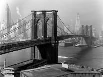 Glittering Night View of the Brooklyn Bridge Spanning the Glassy Waters of the East River-Andreas Feininger-Photographic Print