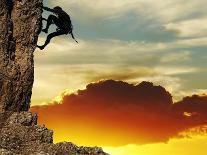 Girl Climbing On The Rock On Sunset Background-Andrushko Galyna-Art Print
