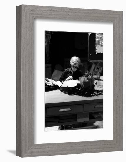 Andy at Typewriter, The Factory, NYC, circa 1965-Andy Warhol/ Nat Finkelstein-Framed Art Print