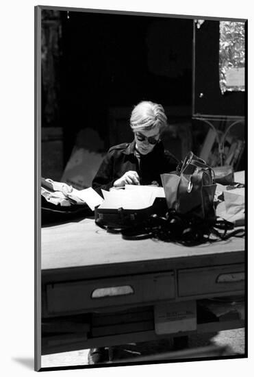 Andy at Typewriter, The Factory, NYC, circa 1965-Andy Warhol/ Nat Finkelstein-Mounted Art Print