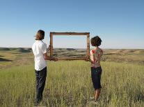 Man and Woman Holding Frame in Open Land-Andy Reynolds-Photographic Print