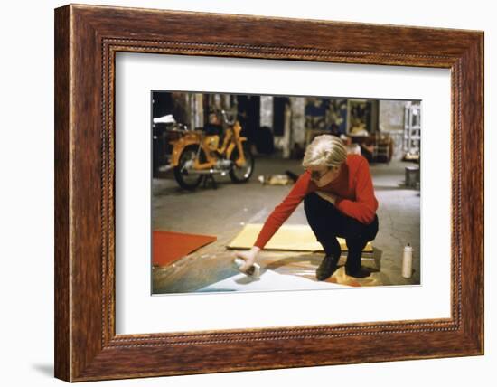 Andy with Spray Paint and Moped, The Factory, NYC, circa 1965-Nat Finkelstein-Framed Art Print