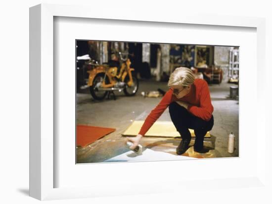 Andy with Spray Paint and Moped, The Factory, NYC, circa 1965-Nat Finkelstein-Framed Art Print