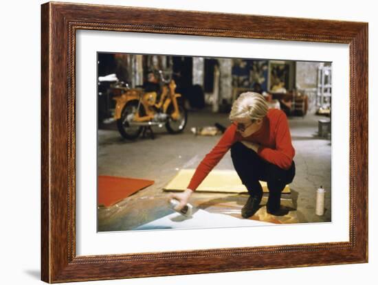 Andy with Spray Paint and Moped, The Factory, NYC, circa 1965-Nat Finkelstein-Framed Art Print