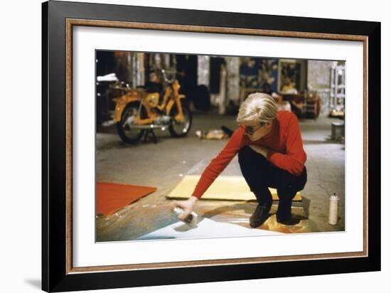 Andy with Spray Paint and Moped, The Factory, NYC, circa 1965-Nat Finkelstein-Framed Art Print