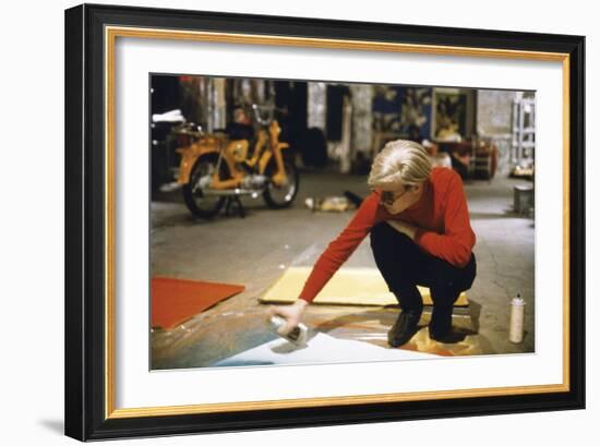 Andy with Spray Paint and Moped, The Factory, NYC, circa 1965-Nat Finkelstein-Framed Art Print