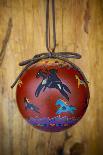 Christmas ornament of a painted ball with colorful Native American horses-Angel Wynn-Photographic Print
