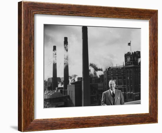 Anheuser Busch Heir Augusta. Busch Jr. Standing in Front of a Budweiser Brewery-Margaret Bourke-White-Framed Photographic Print