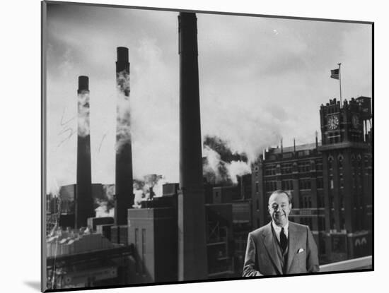 Anheuser Busch Heir Augusta. Busch Jr. Standing in Front of a Budweiser Brewery-Margaret Bourke-White-Mounted Photographic Print