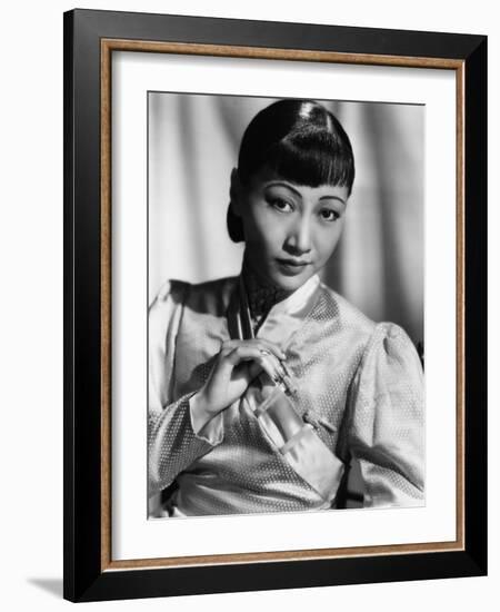 Anna May Wong, in an Orange Nanking Brocade Robe with Sandalwood Fastenings, 1937-null-Framed Photo