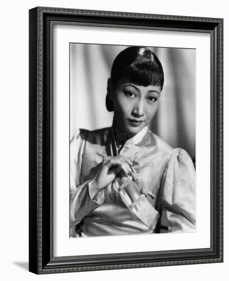 Anna May Wong, in an Orange Nanking Brocade Robe with Sandalwood Fastenings, 1937-null-Framed Photo