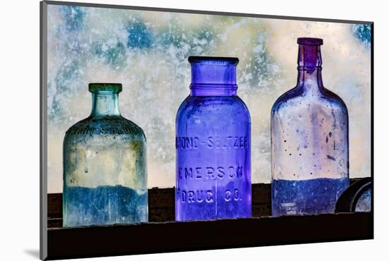 Antique colored bottles in window, Prescott National Forest, Jerome, Arizona-Adam Jones-Mounted Photographic Print