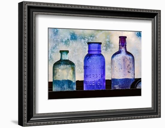 Antique colored bottles in window, Prescott National Forest, Jerome, Arizona-Adam Jones-Framed Photographic Print